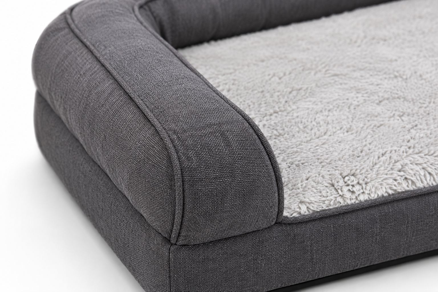 Close-up of a plush, gray dog bed with bolstered sides and soft fabric texture Rectangular Pet Bed with Raised Sides and Plush Interior for Dogs and Cats - Image 2